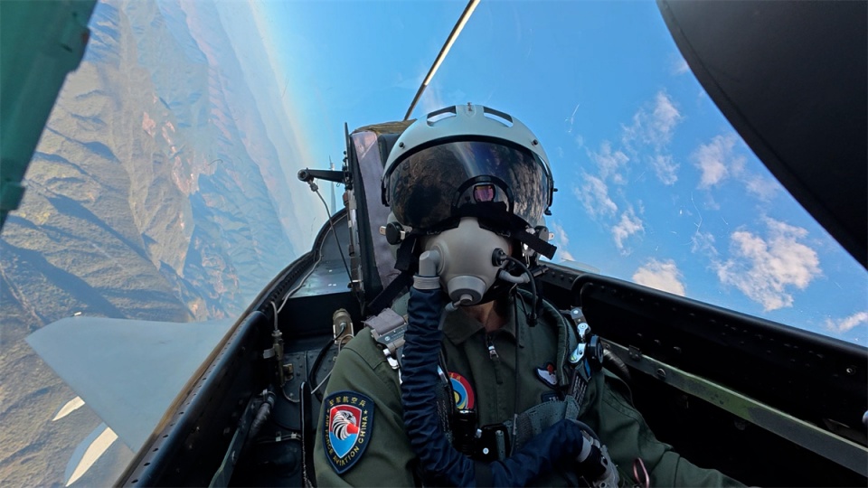 Pilot navigates fighter jet over mountains