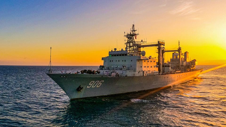 Comprehensive supply ships steam in formation