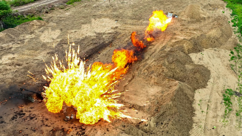 Army soldiers shoot with flamethrowers