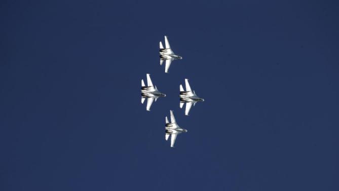 Russian Sukhoi jets fly during the Army-2015 show at a shooting range in Alabino, outside of Moscow, Russia, on Tuesday, June 16, 2015. Russia’s military this year alone will receive over 40 new intercontinental ballistic missiles capable of piercing any missile defences, President Vladimir Putin said Tuesday in a blunt reminder of the nation’s nuclear might amid tensions with the West over Ukraine. (AP Photo/Ivan Sekretarev)