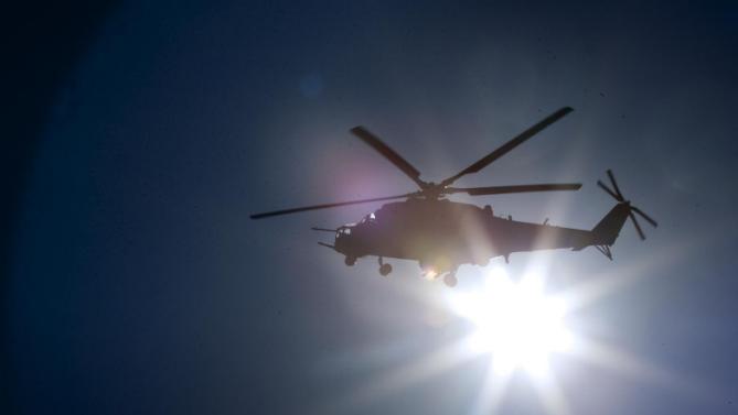 Russian MI-24 attack helicopter flies during the Army-2015 show at a shooting range in Alabino, outside of Moscow, Russia, on Tuesday, June 16, 2015. Russia’s military this year alone will receive over 40 new intercontinental ballistic missiles capable of piercing any missile defences, President Vladimir Putin said Tuesday in a blunt reminder of the nation’s nuclear might amid tensions with the West over Ukraine. (AP Photo/Ivan Sekretarev)