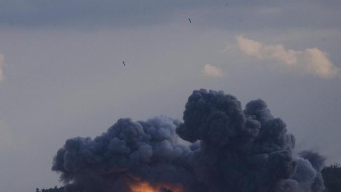 Russian TOS-1A Solntsepyok (Sunheat) heavy flame throwing launcher's rockets explode during the Army-2015 show at a shooting range in Alabino, outside of Moscow, Russia, on Tuesday, June 16, 2015. Russia’s military this year alone will receive over 40 new intercontinental ballistic missiles capable of piercing any missile defences, President Vladimir Putin said Tuesday in a blunt reminder of the nation’s nuclear might amid tensions with the West over Ukraine. (AP Photo/Ivan Sekretarev)